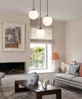 Globe Pendant Light for Kitchen Island 3 Light Milk Glass White Frosted Sphere Ceiling Fixture in cozy living room