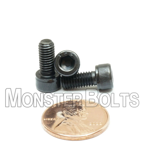 Heavy Duty Number 10-32 By 7/16 Inch Socket Head Cap Screws, ASTM A574 Alloy Steel, shown with a penny for size reference.