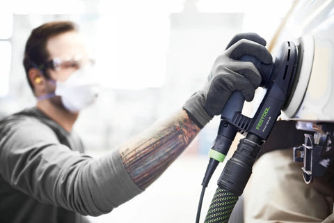 Worker using Platin 2 S1000 Grit 6-Inch Sanding Discs, 15-Pack For Ultra-Fine Finishes on fiberglass surface with sander