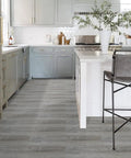 Modern kitchen with Self Adhesive Peel And Stick Floor Tile Set 10 Pack 15 Sq Ft Natural Grey Wood Grain Look Waterproof PVC Vinyl Plank Flooring.