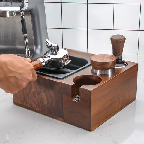 Level Up Your Home Bar Setup With This Sturdy Wood Espresso Tamper Holder And Knock Box For 58mm Portafilters, Keeps Your Workspace Crisp And Totally Stress Free, featuring a hand holding portafilter.