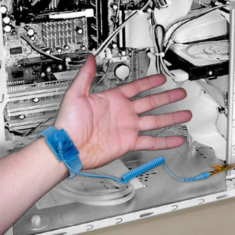 Anti Static Wrist Strap For ESD Grounding in use, adjustable band securing hand while working on open computer case internals