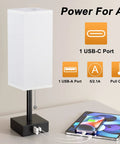 Nightstand Lamp With 3 Color Temperatures 2700K 3500K 5000K, USB C And USB A Ports, Pull Chain Control, Includes LED Bulb, Compact Bedside Lamp For Reading, Chill Vibe, White Finish next to a phone
