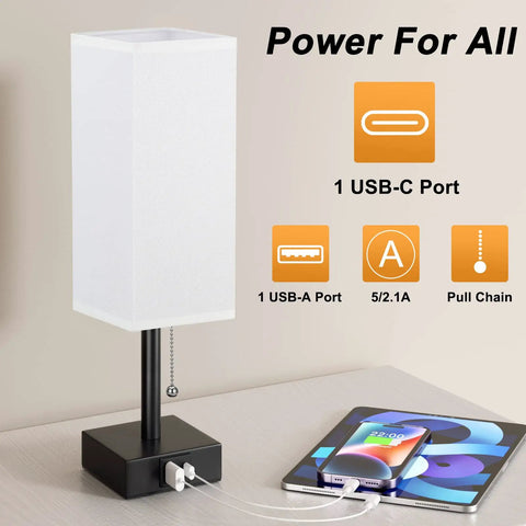 Nightstand Lamp With 3 Color Temperatures 2700K 3500K 5000K, USB C And USB A Ports, Pull Chain Control, Includes LED Bulb, Compact Bedside Lamp For Reading, Chill Vibe, White Finish next to a phone