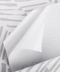 Gray Striped Peel And Stick Wallpaper Roll 17.7 Inches Wide By 394 Inches Long, close-up of adhesive back showing pattern and texture.