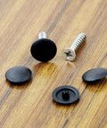 Multi-Function Hinged Screw Cover Caps Set For Self-Tapping Screws, Decorative Black Caps on wooden surface, 100 Piece Pack