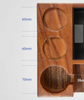 Close-up of solid wood espresso tamper holder combo with measurements for integrated knock box and grounds bin for 58mm portafilters.