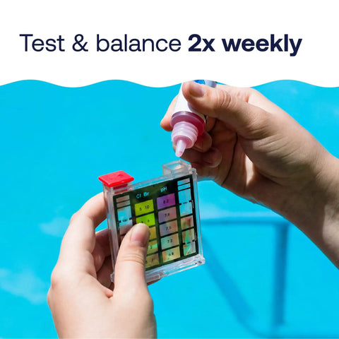 Hand holding Nail Flawless Pool Chemistry In A Snap With This Six Way Swimming Pool Water Test Kit analyzing water quality.