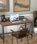 Smooth Ride Rolling Computer Desk With Lockable Wheels And Heavy Duty Steel Frame Portable Laptop Workstation in home office setting.