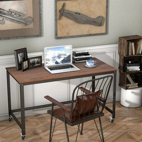 Smooth Ride Rolling Computer Desk With Lockable Wheels And Heavy Duty Steel Frame Portable Laptop Workstation in home office setting.