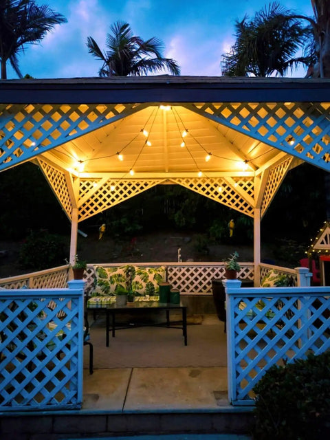 Solar Powered Outdoor String Lights 48 Ft Edison Bulbs Shatterproof LED Warm White Commercial Grade Patio Lights For Garden Pergola Bistro Vibe Great For Outdoor Parties illuminating gazebo at dusk