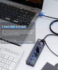7-Port USB 3.0 Hub With 3ft Cable For Laptop PC Surface Pro PS4 And PS5, Individual LED On Off Per Port, connected to a laptop