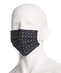 Model wearing black pleated mask from Six Pack Reusable Pleated Cloth Face Masks With Assorted Prints And Colors, One Size, Cotton, Washable