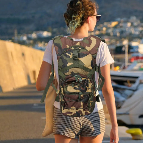 Go To Lightweight Hiking Backpack For Women, Oxford Cloth Daypack In Jungle Camo, worn by a woman outdoors.