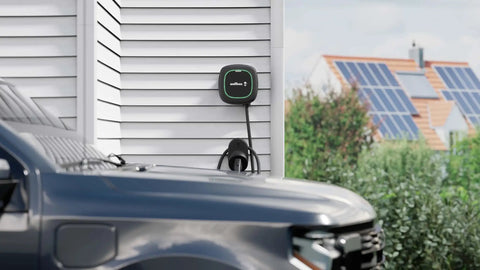 Rugged EV Charger Cable Holster For J1772 Connectors mounted on wall with charging cable neatly organized beside a vehicle.