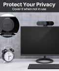 Crystal Clear 1080P HD Webcam With Four Noise Blocking Mics And Dual Built In Speakers Adjustable Wide Angle Lens depicting privacy cover on monitor.