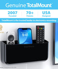 Hole-Free Remote Holder With Adhesive Mount, No Drilling Required, holding three remotes, installed near a TV, black design