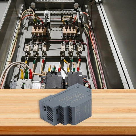Solid As A Rock Din Rail Power Supply 12 Volt 2.5 Amp 24 Watt Industrial Switching Adapter positioned in a control panel.