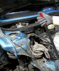 Mechanic using Beefy Heavy Duty Serpentine Belt Removal Tensioner Tool for Mini Cooper S R52 R53 and BMW W11 engines in engine bay.