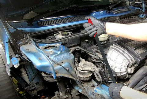 Mechanic using Beefy Heavy Duty Serpentine Belt Removal Tensioner Tool for Mini Cooper S R52 R53 and BMW W11 engines in engine bay.