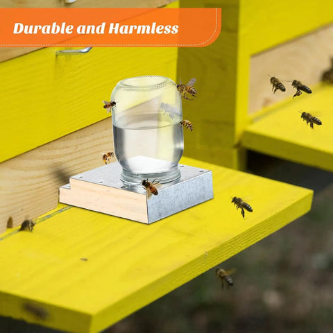 Two Pack Light Wood Beehive Entrance Feeders with bees drinking from jar placed on yellow hive platform.