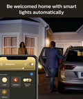 House with Lucca Outdoor Smart Wall Light With Color Ambiance LED Bulb Black E26 Weatherproof Porch Lighting, app control shown.