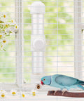 Gotta Have Cage Mounted Bird Water Bottle With Zero Drip Copper Needle Valve and Leak Proof Spring Dispenser for Parrots Budgies Finches next to a bird.