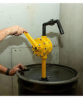 Hand Crank Manual Oil Pump Self Priming Drum Extractor For Diesel Gasoline Corrosion Resistant in use, yellow engineered plastic, one hand operation.