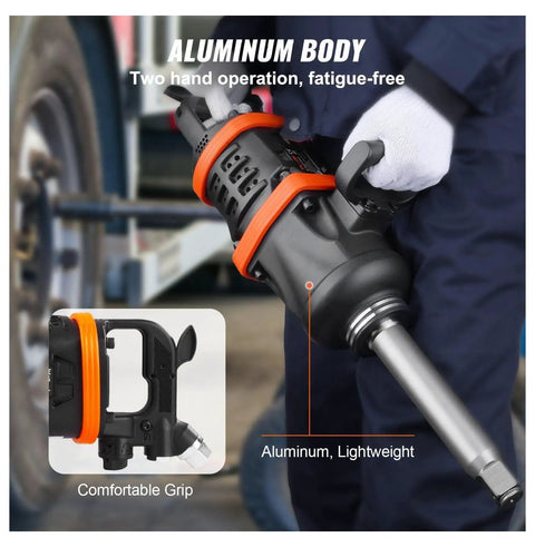 Professional Grade One Inch Air Impact Wrench Built Like A Tank To Handle Heavy Duty Tasks With 5175 Foot Pounds Breakaway Torque For Semi Trucks Buses And Shop Floor Mechanics Featuring An Eight Inch Extended Reach Anvil - aluminum body and comfortable grip in use.