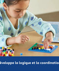 Child using STEM Explorers Pixel Art Challenge Kit For Kids Kid Approved 40 Hands On Science And Math Activities Pattern Blocks