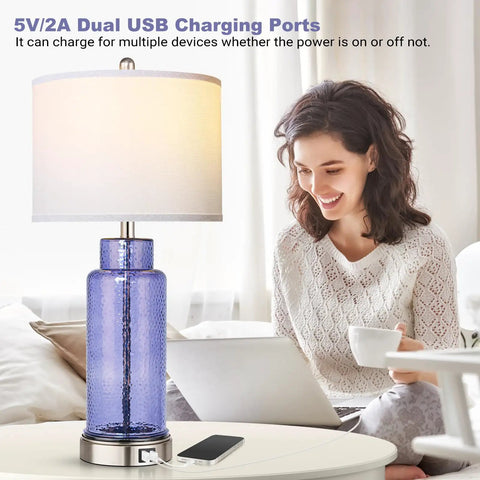 Set Of 2 Blue Glass Table Lamps 26 Inches Tall With White Shade, Touch Control And USB Ports, Dope Modern Coastal Nightstand Lighting For Bedroom Or Living Room, LED Bulbs Included next to person working on laptop