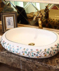 Damn Fine Hand Painted Oval Countertop Washbasin With A Truly Knockout Leaf Pattern Heavy Duty Ceramic Bathroom Sink with gold faucet.