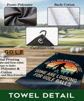 Not All Who Wander Are Lost golf towel, polyester front, cotton back, carabiner clip shown on grassy golf course background.