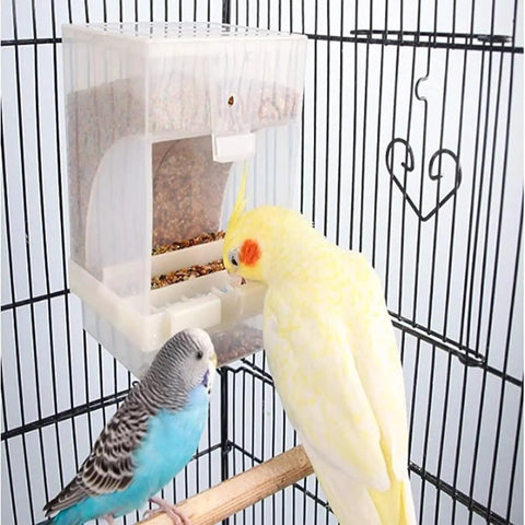 Two Piece No Mess Automatic Bird Feeder For Pet Cages with a yellow cockatiel and blue budgie in a cage.