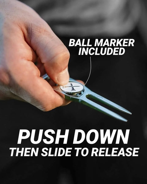 Close-up of Six In One Premium Golf Divot Tool with Magnetic Ball Marker, being used to repair a golf green.
