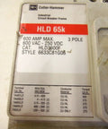 Close-up of HLD 65k industrial circuit breaker frame showing specs, 600 amp max, 3 pole, CU/AL conductor material.