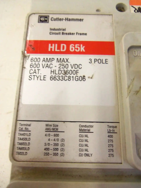Close-up of HLD 65k industrial circuit breaker frame showing specs, 600 amp max, 3 pole, CU/AL conductor material.