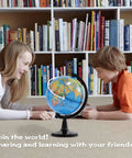 Two children playing with a Compact Four Inch Globe For Kids And Classroom Learning Portable Desktop World Map With Latitude Scale