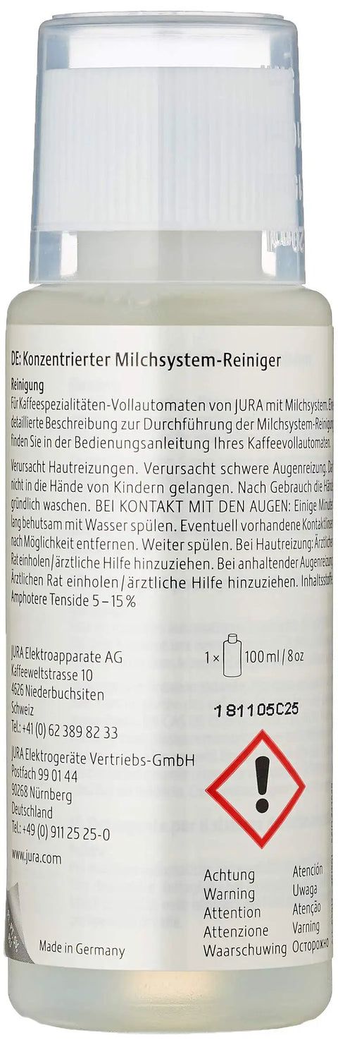 Bottle of milk system cleaner with German instructions and warnings, labeled "Made in Germany"
