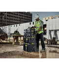 Worker using Dual Port Charger For ToughSystem 2.0 20V Max Batteries With Dual USB Ports And IP55 Dust And Water Protection on a job site