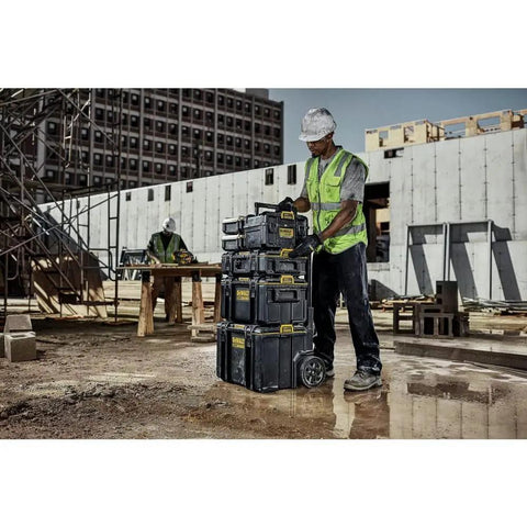 Worker using Dual Port Charger For ToughSystem 2.0 20V Max Batteries With Dual USB Ports And IP55 Dust And Water Protection on a job site