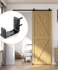 Adjustable Sliding Barn Door Floor Guide With Smooth Glide Rollers For No Sweat Wall Mounted Setup In Black Bulletproof Heavy Duty Aluminum Hardware Kit close-up of black floor guide mounted under barn door.