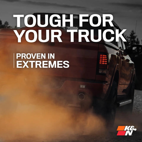 Truck driving through dirt with text 'Tough for Your Truck' and 'Proven in Extremes,' highlighting rugged performance of vehicle products.