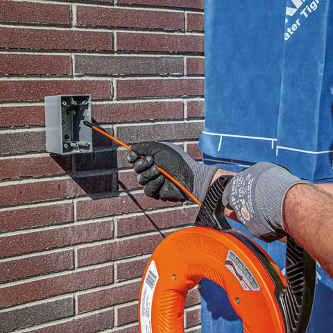 Non Conductive Electrical Fish Tape With Multi Groove Fiberglass Wire Puller Nylon Tip And Pro Grade Housing In Use Outdoors