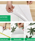 Close-up of Tropical Palm Leaf Dope Easy Peel and Stick Wallpaper, showing peel and stick feature, cutting, and tropical design.