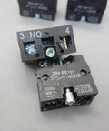 Close-up of Ten Pack Snap In Momentary Push Button Switch Contact Block with Screw Clamp Terminals, showcasing connection points.