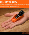 Jorgensen No.101 mini wood plane with orange body and black handle held in a hand