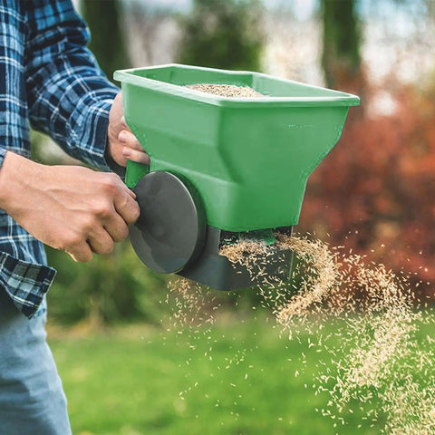 Effortless Hand Crank Seed Spreader 1.5L for Garden and Lawn, Portable Manual Seeder in use scattering seeds evenly