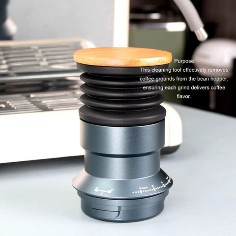 Solid Manual Single Dose Coffee Grinder Featuring Smooth Burr Mechanism And Silicone Bellow Blower For Hassle Free Cleanup Walnut Wood Lid Aluminum Frame, Close-up view of tool with walnut lid.