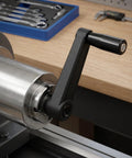 Essential 5-Inch Industrial Hand Crank Handle Set, ergonomic black nylon crank handle attached to a milling machine.